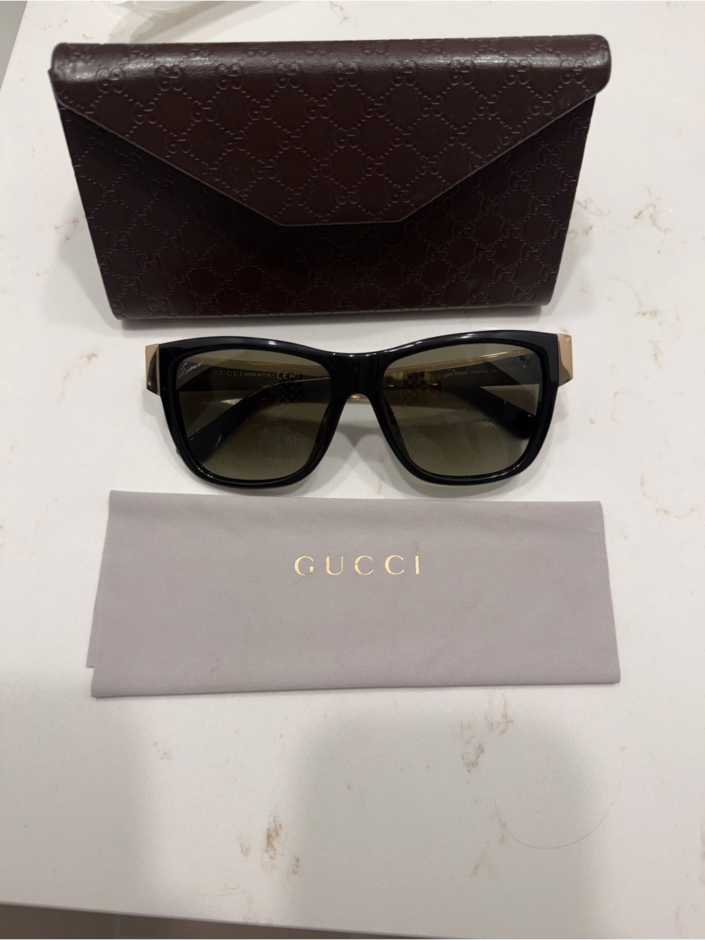 Gucci Black Sunglasses with Gold Temple Accents